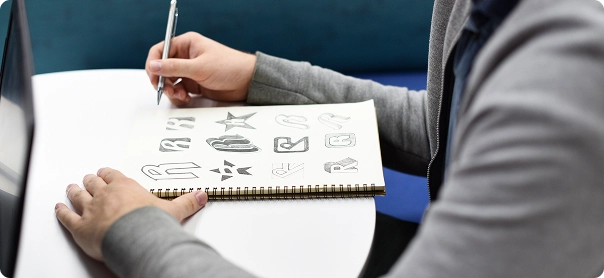 Sketching Out Different Logo Concepts - Ectesso 