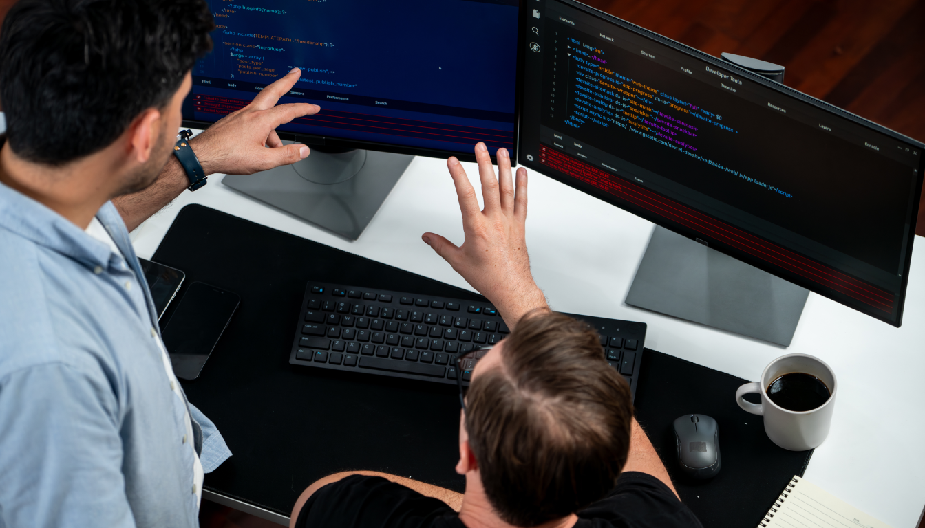 Developers working on custom website development using code